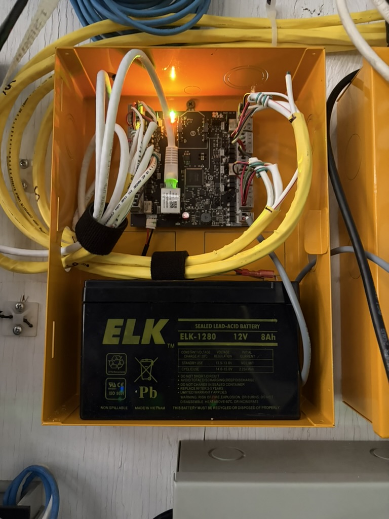 ProDataKey access controller and backup battery inside a wall enclosure
