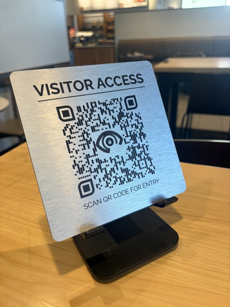 Brushed-metal visitor QR code check-in sign for building access
